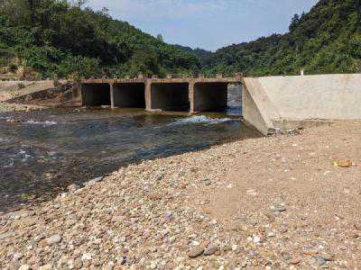 A river with a concrete bridge crossing it where I washed my face